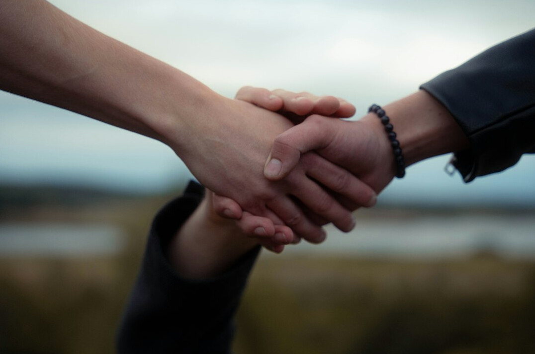 rivals shaking hands