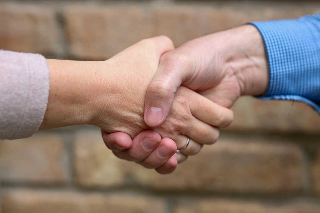 celebrities shaking hands